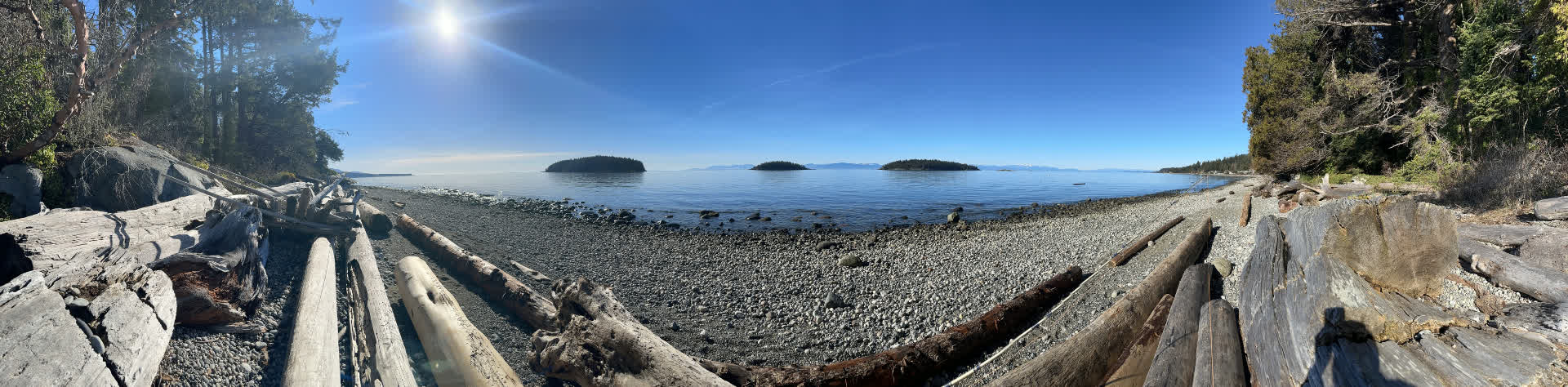 Panoramic view of three islands from a rocky Pacific Northwest beach